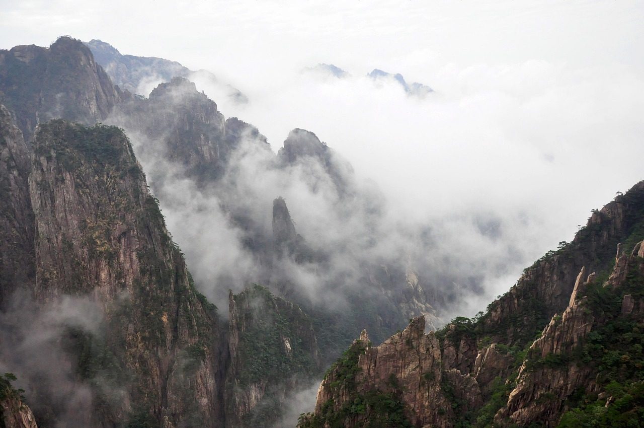 nature  mountain  landscape  rock  travel  huangshan  china  sea of clouds  cloud sea  ink  spring outing  artistic conception  clouds  black and white  natural