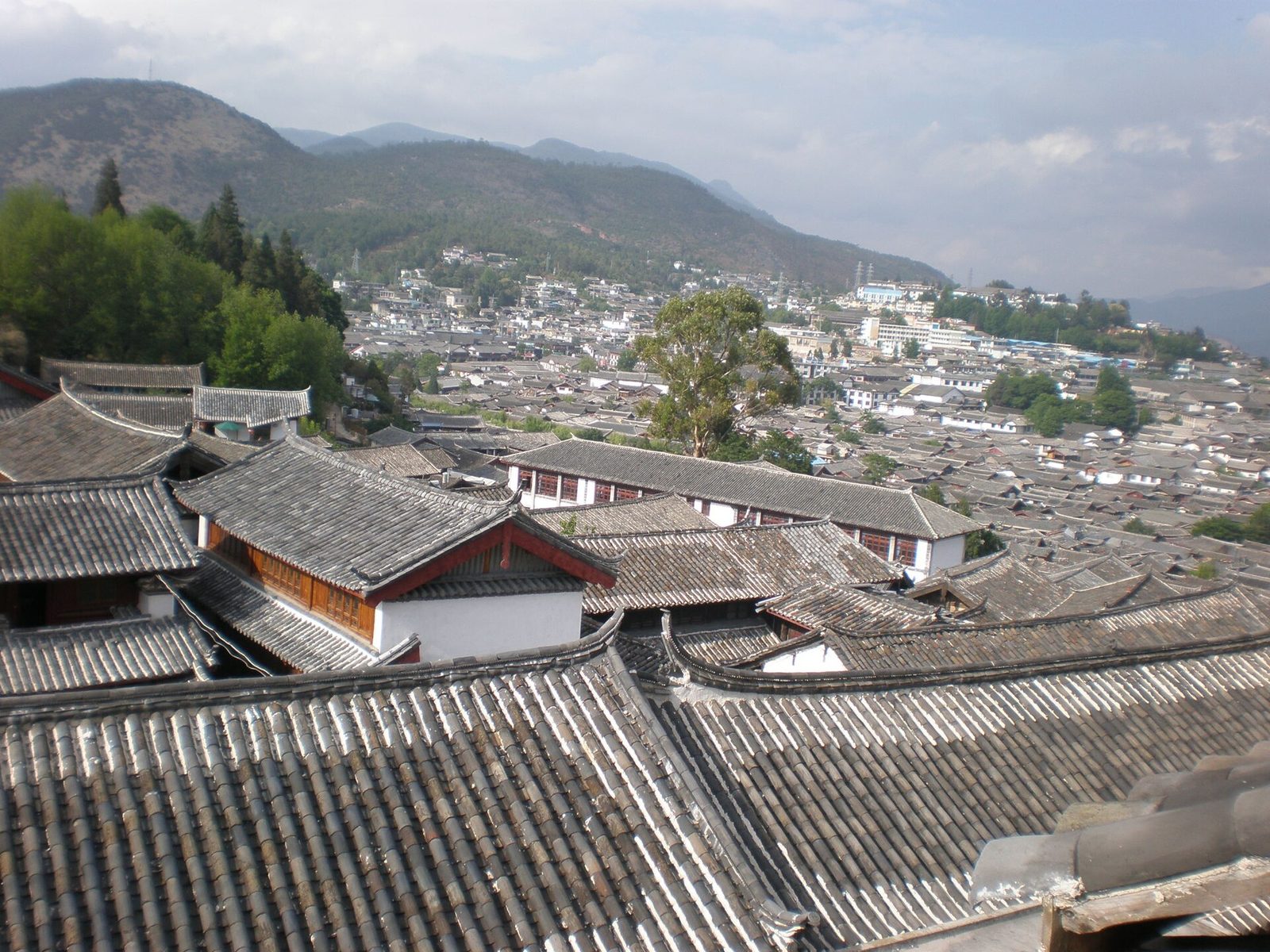 Roofs of the Old Town of Lijiang, Yunnan, as seen from the third floor of the Jing Man Lou Inn on Xinhua Street Upper Huangshan.