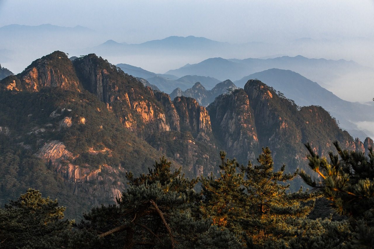 mountains forest trees fog sunset clouds sky nature outdoors dawn panorama landscape China Huangshan City Anhui