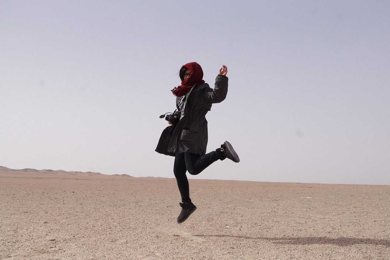 travel nature happy jump dunhuang desert china woman